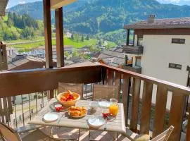 Village center with balcony view and parking