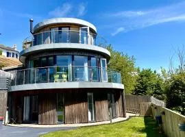 One of the best properties in Lyme! Breathtaking views across the whole bay. 3 stories with 2 tier veranda around the property. Sleeps 6