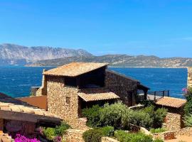 SAN TEODORO PUNTA EST AMPIO TRILOCALE VISTA MARe – hotel w mieście Capo Coda Cavallo