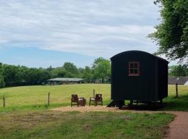 Shepherds hut surrounded by fields and the Jurassic coast, campsite in Bridport