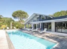 Ref 111 Seignosse, Villa de standing 4 étoiles partiellement climatisée avec piscine chauffée et Wifi au calme sur terrain 1100m2
