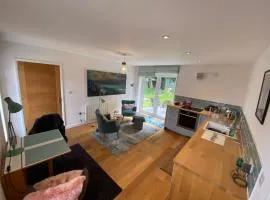 Self-contained, ground floor apartment with parking and patio