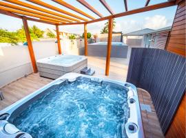 Studio Jacuzzis et piscine au centre ville de Port-Louis, lejlighed i Port-Louis