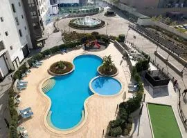 Lovely 2 bedroom duplex with a pool in front AUC