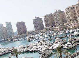 Luxury 2 bedroom Apt in The Pearl with Marina view: Doha'da bir otel