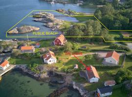 Holiday house with sea views and private beach on Tjorn, hotell i Höviksnäs