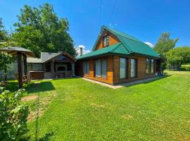 near waterfall, cottage in Skole