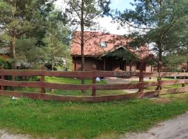 Trójmiasto nad jeziorem DOM -ECHOCHATA, golfový hotel v destinaci Kamień