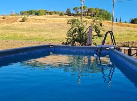 VAL D'ORCIA DELUXE 1 ELEGANTE CASA immersa nel verde con WiFi, giardino e parcheggio, departamento en San Giovanni dʼAsso