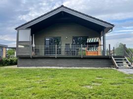 Ferienhaus Haus Seehund direkt hinterm Deich an der Nordsee, παραθεριστική κατοικία σε Schweiburg