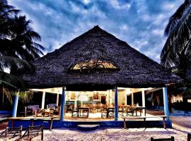Oasis Beach Inn, отель в Джамбиани