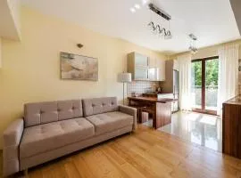 Green District 2BR AirConditioned P by BookingHost