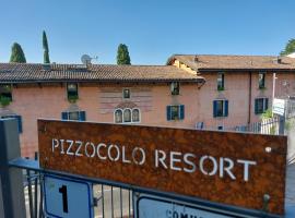 Pizzocolo resort fasano, bolig ved stranden i Gardone Riviera