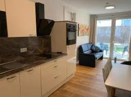 Modern apartment with garden near city center