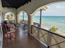 Breezy Ocean Front Condo Close to The Best Beaches, hotel in Christ Church