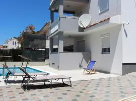 Family friendly apartments with a swimming pool Tisno, Murter - 5073