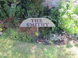 The Smithy, дом для отпуска в городе Снеттишам
