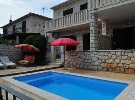 Seaside apartments with a swimming pool Supetar, Brac - 11360