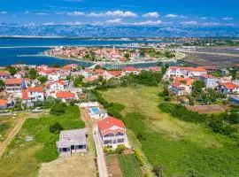 Family friendly apartments with a swimming pool Nin, Zadar - 18821