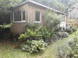 Tranquil wood cabin set in a beautiful orchard