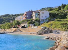 Apartments by the sea Podgora, Makarska - 2614, hotel em Podgora