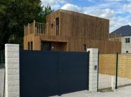 Duplex atypique en bois entre ville et verdures