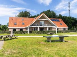 Large apartment on Ameland with terrace, hotel in Nes