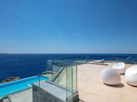 Kotedža Seafront luxury villa with infinity pool & devine views! pilsētā Ajospavlosa