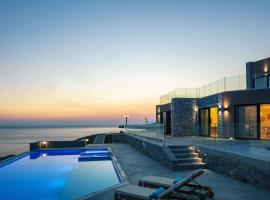 Seafront luxury villa with infinity pool & devine views!, vakantiewoning in Agios Pavlos