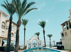 Apartamento primera línea playa Muchavista El Campello con piscina