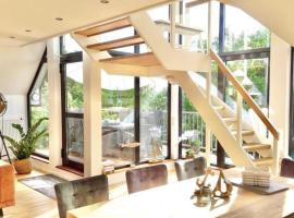 Dünenhaus Ferienwohnung De Düün Sess, מלון בוגנרוגה