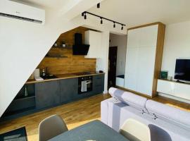 Nowe 3 pokojowe mieszkanie z dużym tarasem – hotel w pobliżu miejsca Winiary Arena w Kaliszu