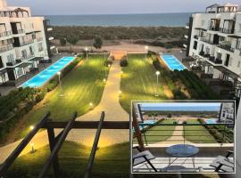 Seaside modern holiday home for family, hotel with pools in Vokolidha