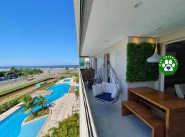 Home 1 | Ap Cinema Resort Frente Mar com Piscina Aquecida, hotel in Bertioga