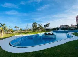 Precioso apartamento 1ª línea de playa con piscina