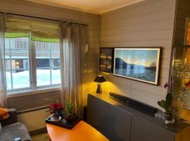 Koselig leilighet , med parkering og ski in &out., hotel a Oppdal