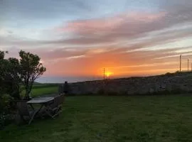 Lovely spacious flat with sea views, sunsets, garden and woodburner