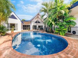 An Absolute Poolside Break by Casuarina Beach, cottage in Casuarina