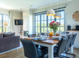 Reetland am Meer - Luxus Reetdachvilla mit 3 Schlafzimmern, Sauna und Kamin E27, ξενοδοχείο σε Dranske