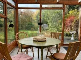 House with a magical garden and sunroom