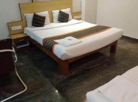 pickurstay New SLV Grand inn, hotel near Tirupati Airport - TIR, Tirupati