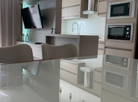 Encanto dos Mares - Apartamento premium 4, hotel em Camboriú