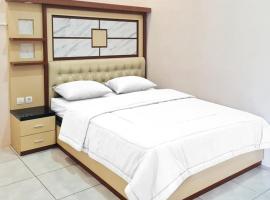 RedDoorz @ Jalan Nyai Enat Sampit, hotel v destinaci Sampit