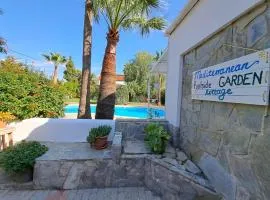 Mediterranean poolside garden cottage
