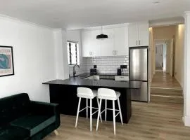 Centrally located modern 2-bedroom home & parking