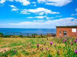 Sunset sea view chalet with hot tub