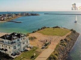 Ferienhaus Strand Hus by Seeblick Ferien ORO, Bestlage am Strand,Sauna,Kamin, hotel v destinaci Olpenitz