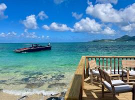 La Plage Bleue feet in the water with swimming pool, holiday rental in Baie Nettle