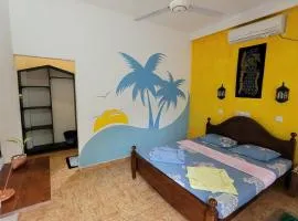 Malika's Yellow House