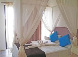 Lovely 3-bedroom at Azuri Ocean & Golf village, hotel with parking in Roches Noires
